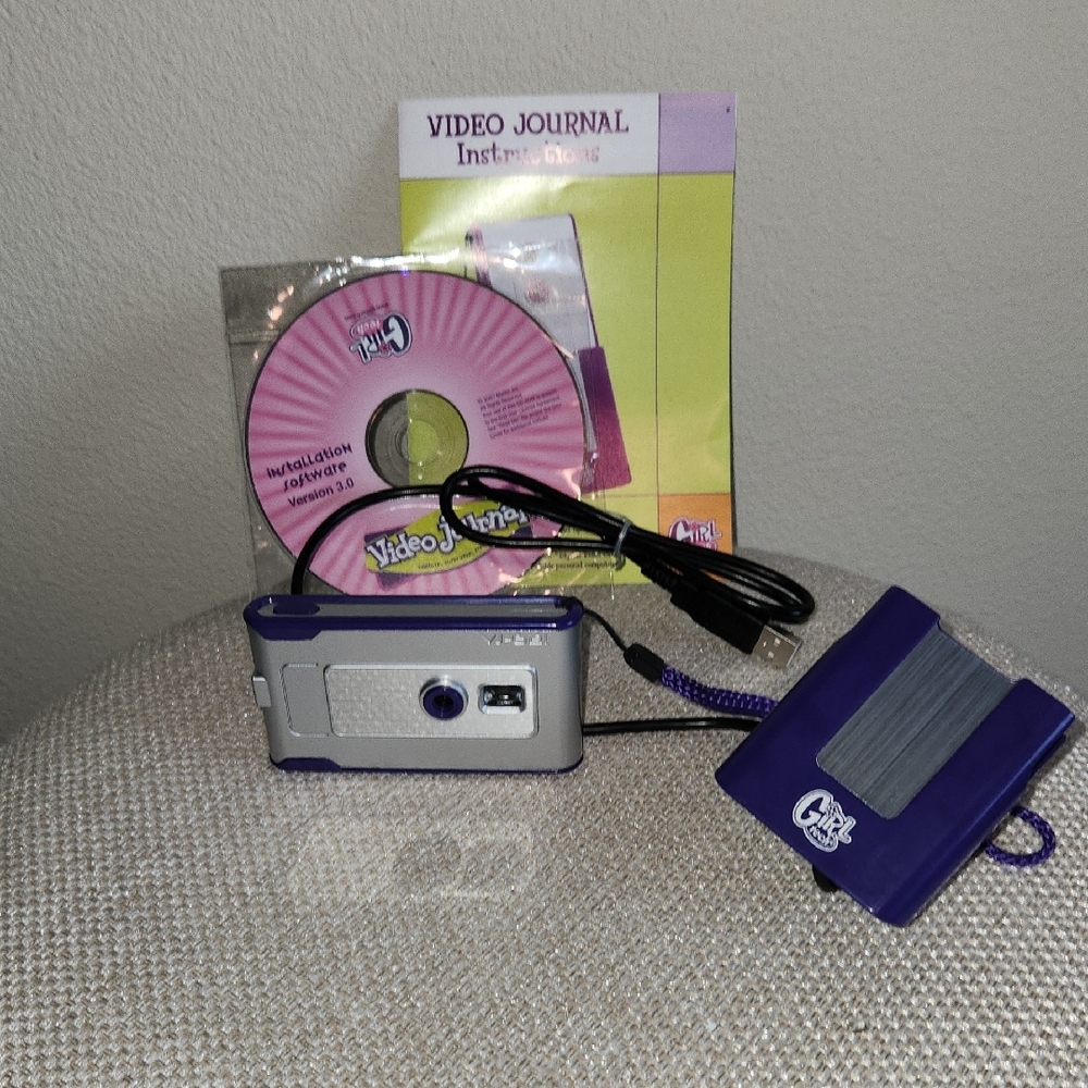 Sleek Silver and Purple Digital Camera with Photo Storage